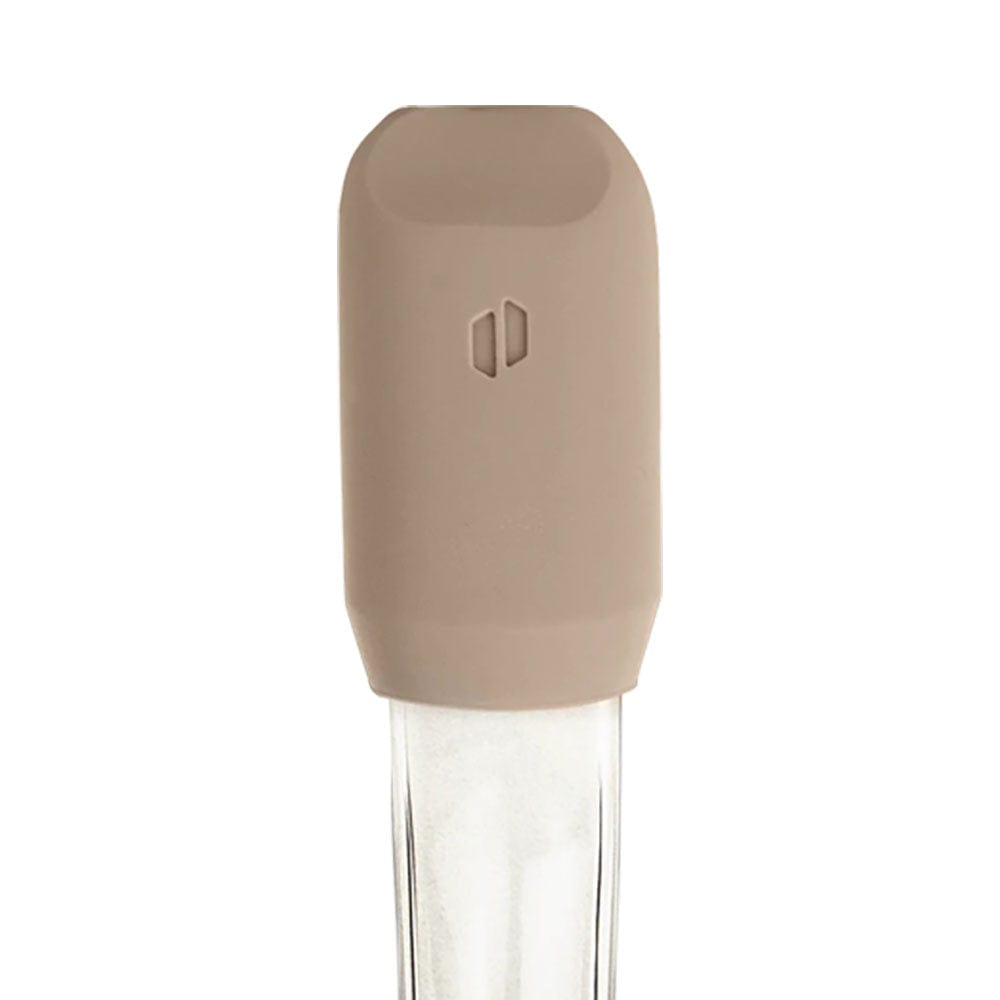 A close-up, angled view of the “Desert” Travel Pack by Proxy, showing a clear glass piece with a simple, cylindrical shape.