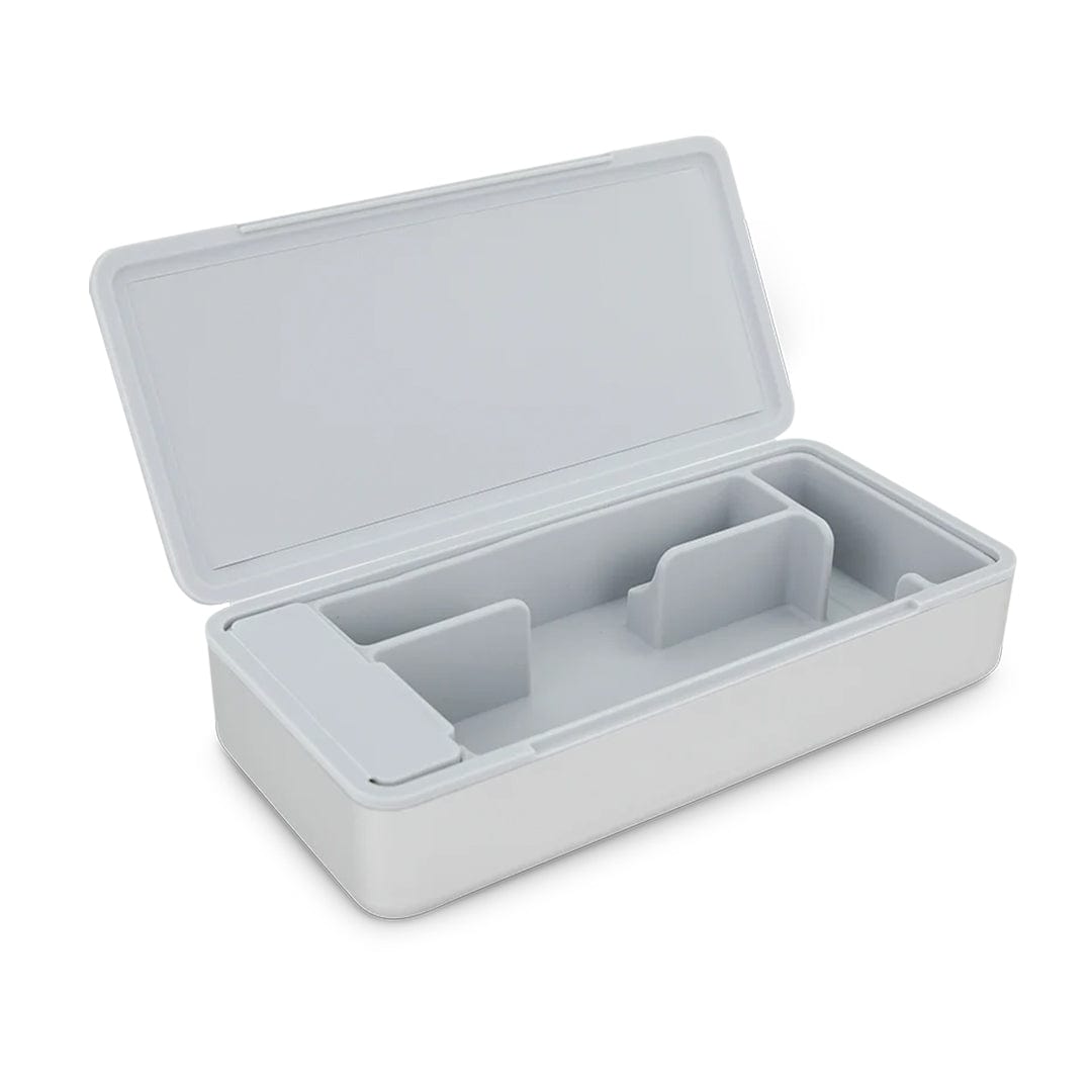 Angled top-down view of an open Puffco Pivot Travel Case showing its light gray molded interior compartments and hinged lid on a white background