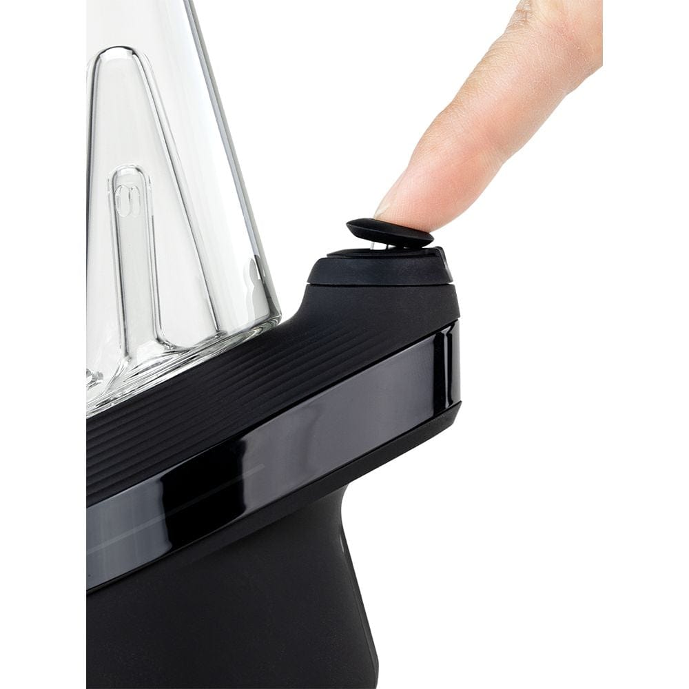 A close-up, angled view of the Puffco New Peak Vaporizer, highlighting its smooth, dark glass form.