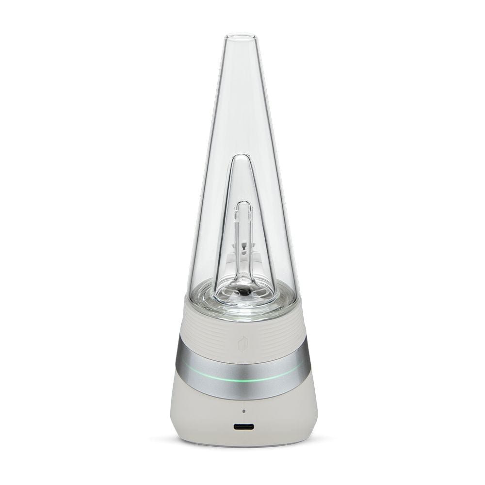A front view of the Puffco New Peak Vaporizer, showcasing its sleek, modern design with a polished metallic base and clear glass top.