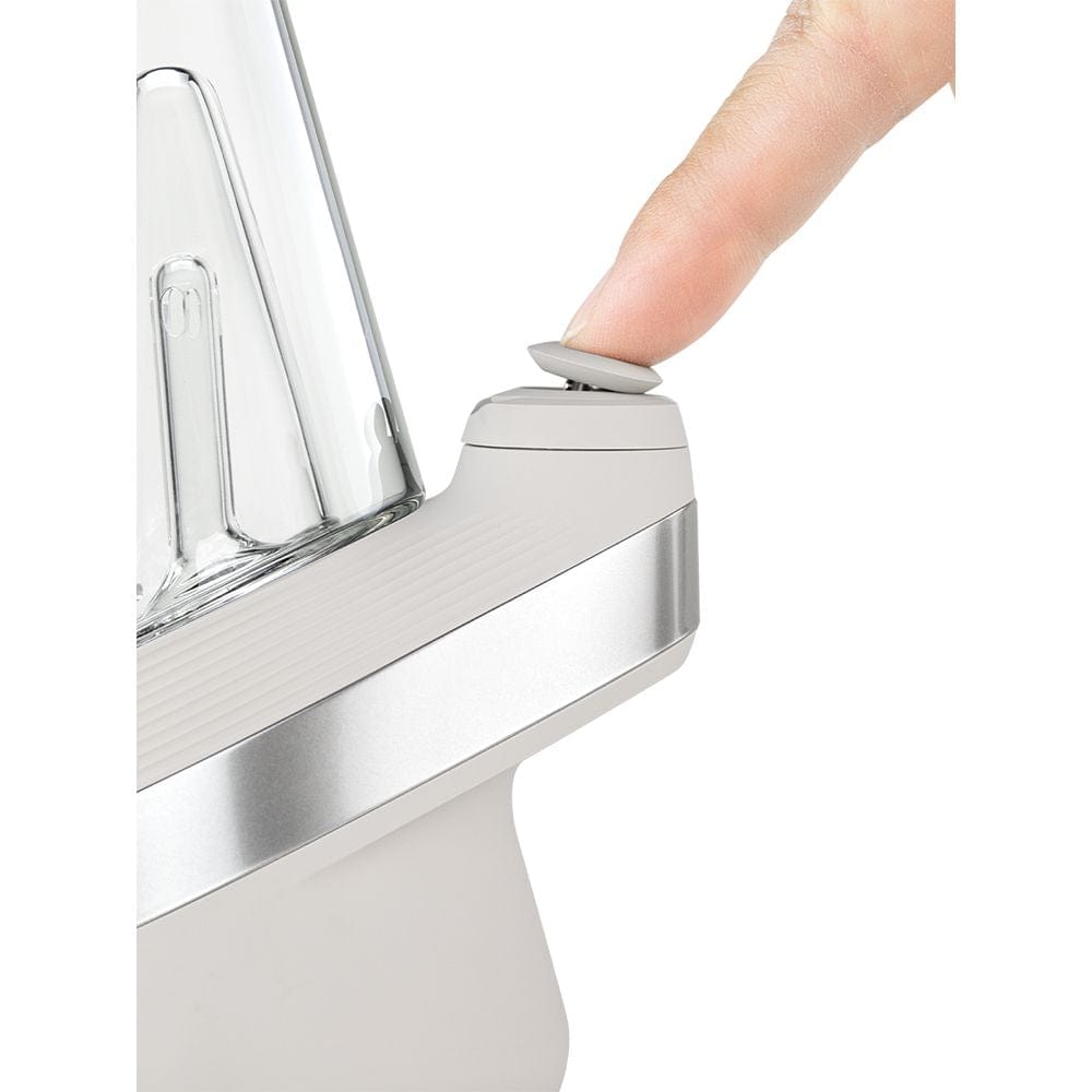 Close-up, angled view of a finger touching the Puffco New Peak Vaporizer, highlighting its sleek, modern design.