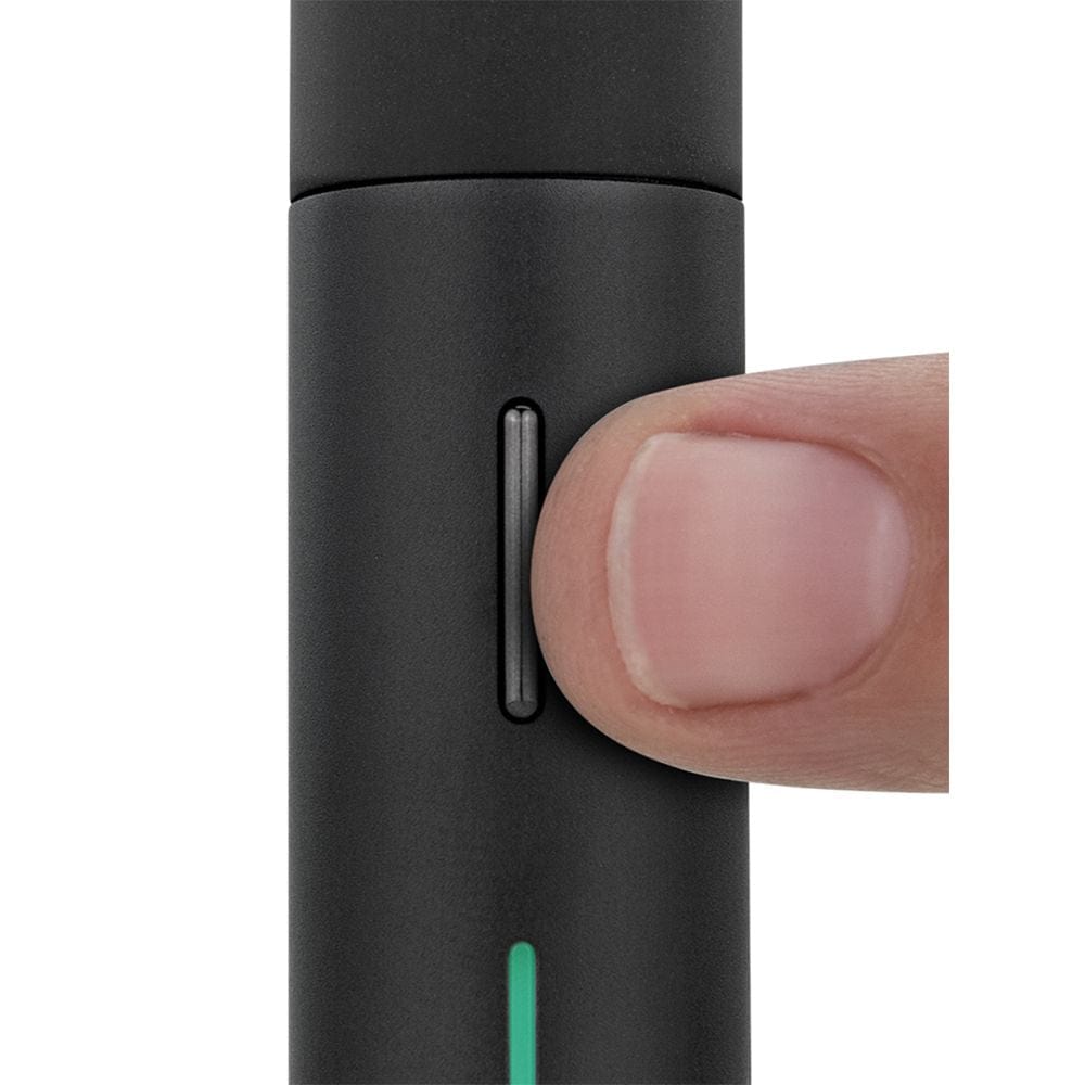 Close-up, angled view of the Puffco Pivot Concentrate Vaporizer, with a finger touching its black, cylindrical body.