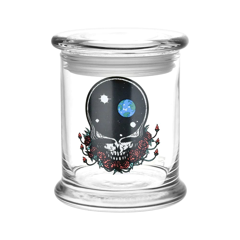 Front view of the Grateful Dead x Pulsar Pop Top 1/2oz Jar, showcasing a clear glass container with a decorative lid.