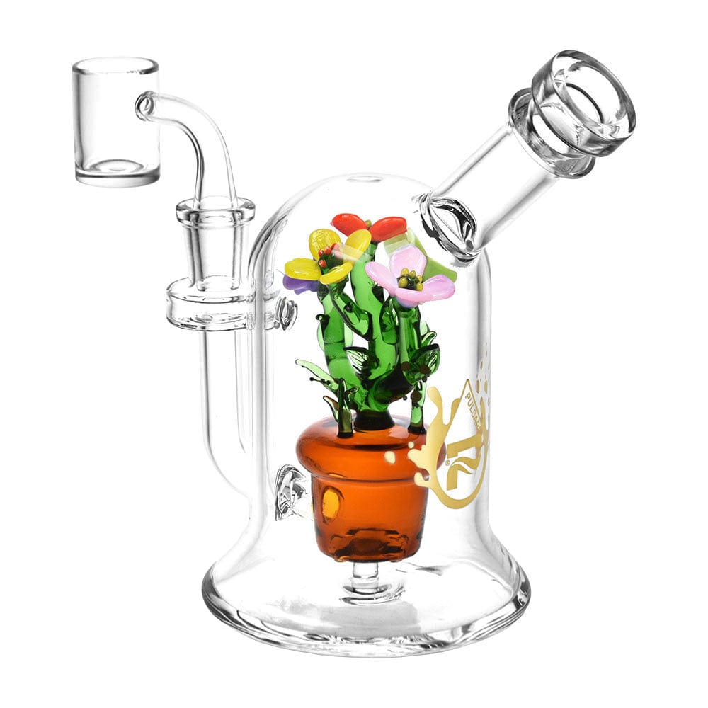 A three-quarter view of the Pretty Flowers Dab Rig, showcasing a colorful floral design emerging from the clear glass base.