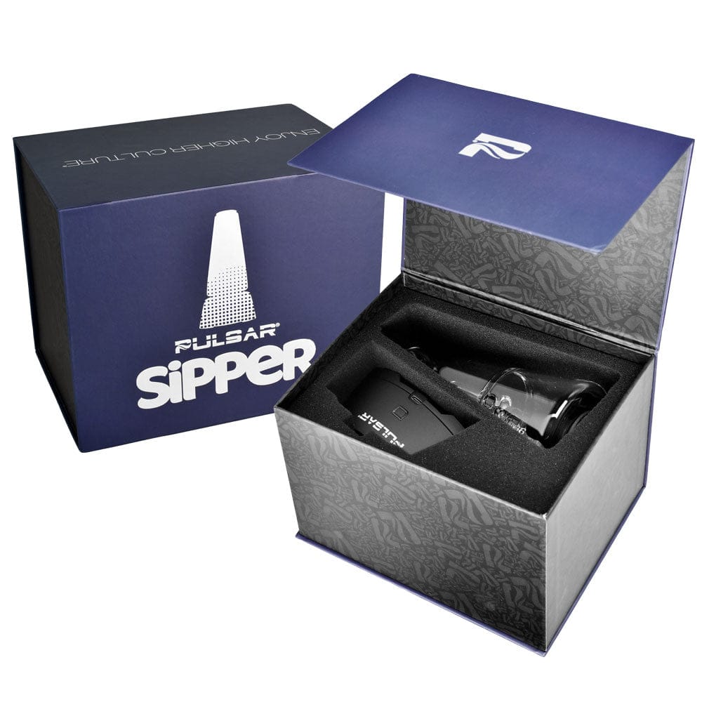 Angled top view of the Pulsar Sipper Wax & 510 Cartridge Vaporizer Bubbler in its open purple box showing the device and glass inserter.
