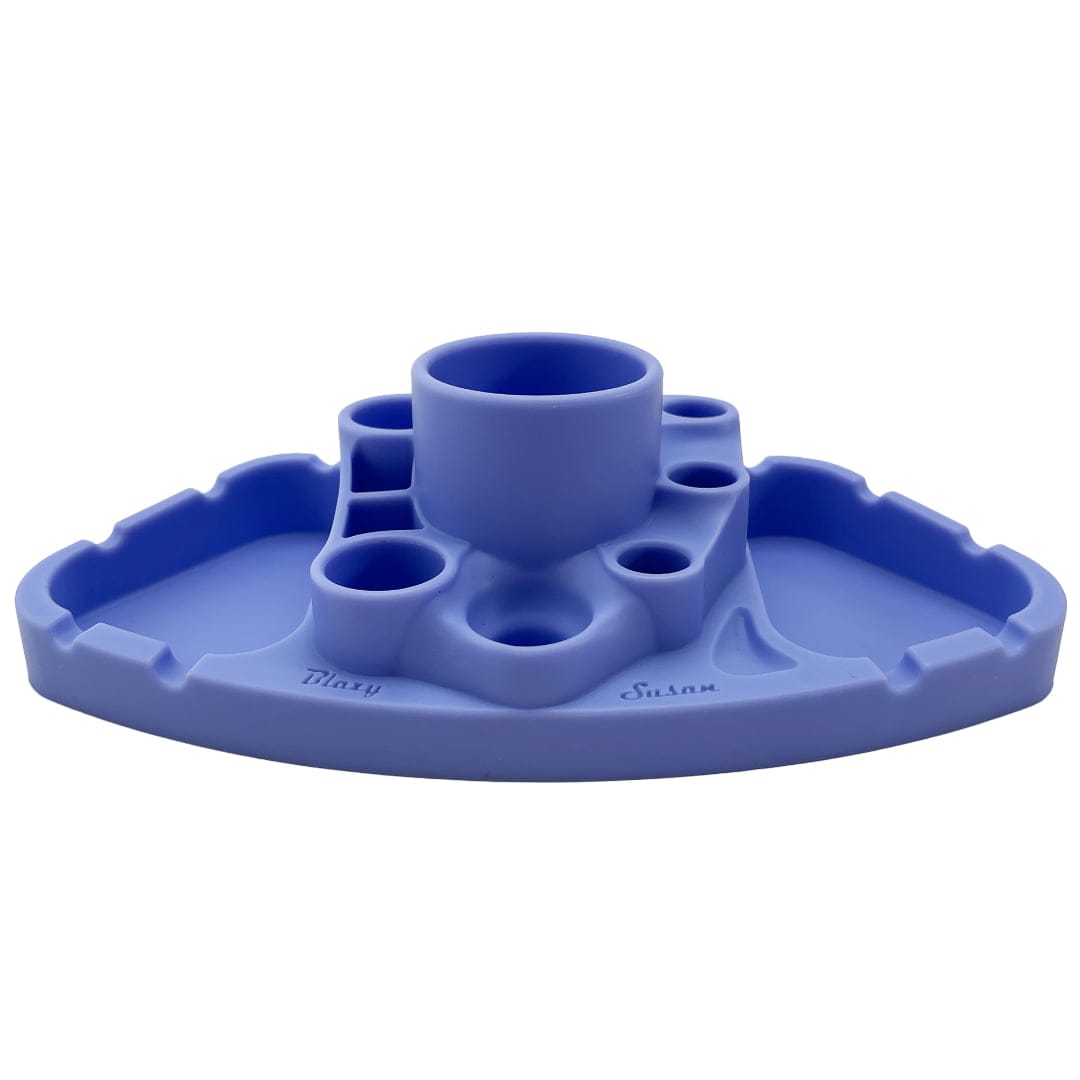 Low-angle front view of a black Blazy Susan Deluxe Dab Station (shown here in blue) with a central cup, multiple small recesses and side trays on a white background