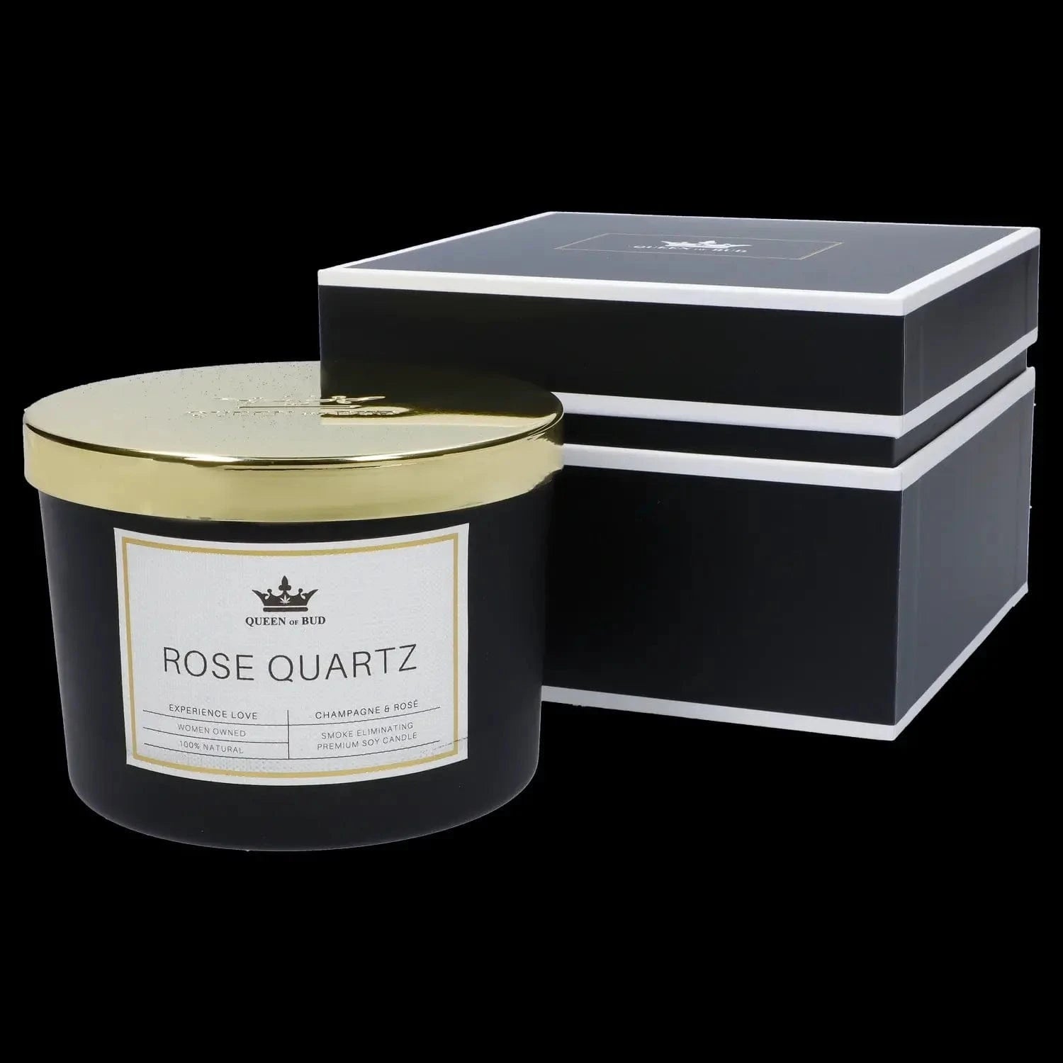 Angled close-up of a black and gold jar and matching box labeled "Queen of Bud Candle" with a visible "Rose Quartz" label.