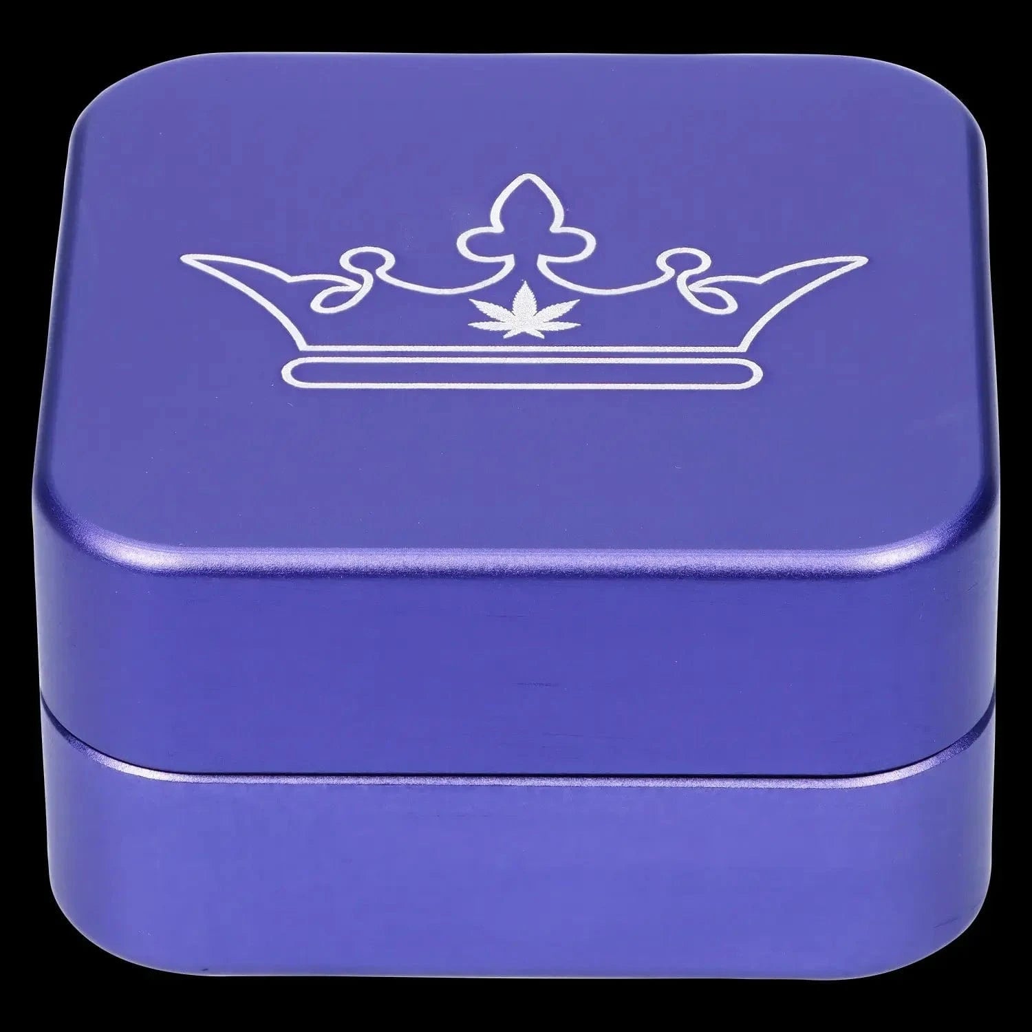 Close-up top-down view of the purple QOB 2-Piece Grinder - 55mm showing a white crown emblem etched on the lid.