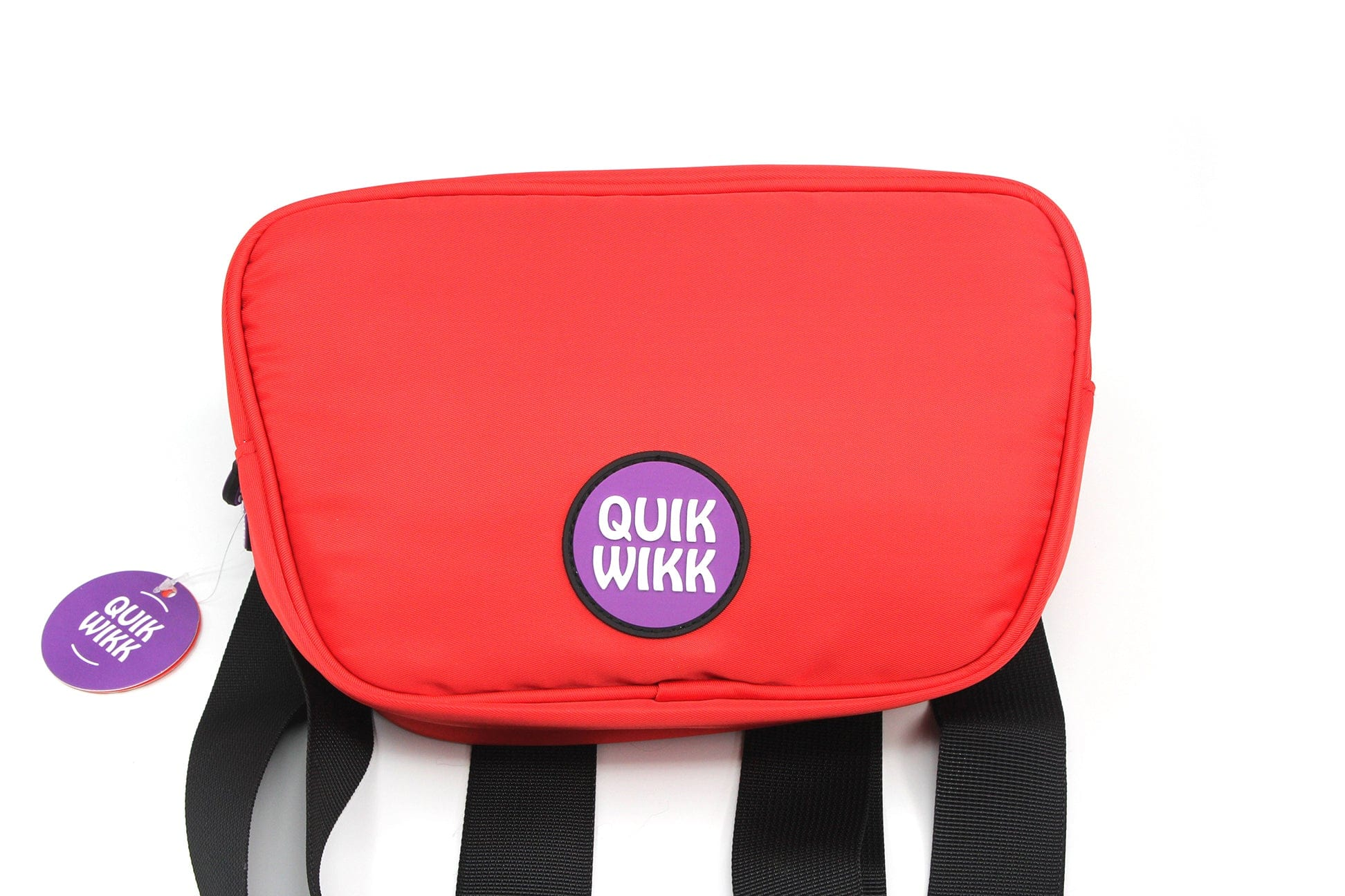 Close-up front view of a red Quik Wikk Fanny Pack showing its rounded top, central purple logo patch, and black straps against a white background