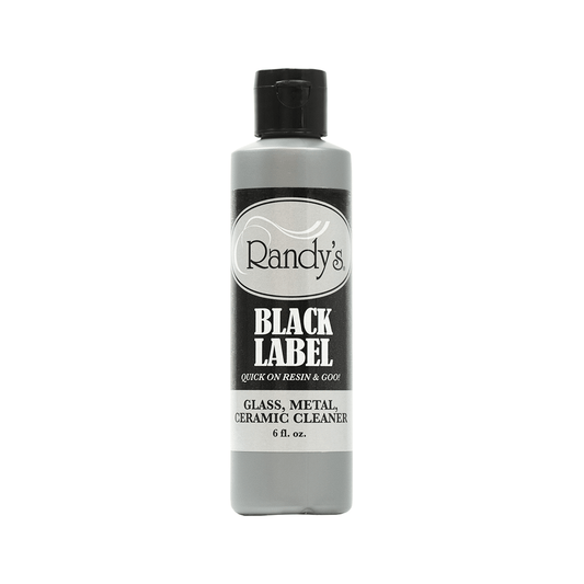 Front view of the Black Label Cleaner bottle against a plain white background, showcasing its label and cylindrical shape.