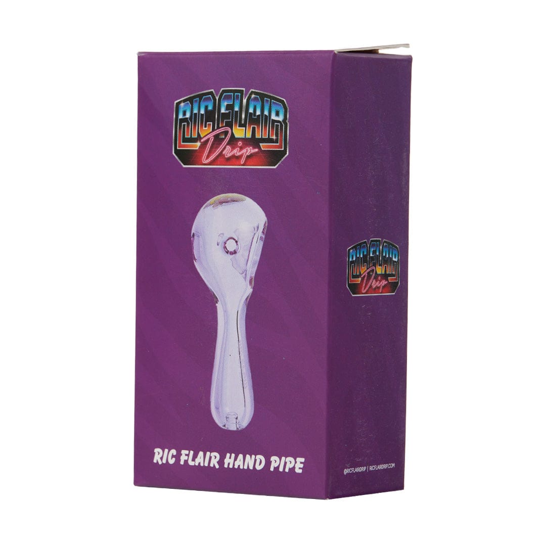 A close-up, angled view of the Ric Flair Drip Spoon Pipe, showcasing its smooth glass design and branded logo.