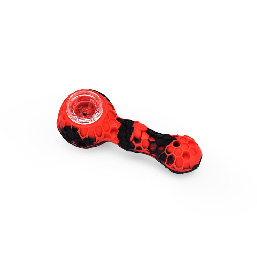 A close-up, angled view of the 4'' Silicone Spoon Pipe - Red & Black, showcasing its curved shape and two-tone color scheme.