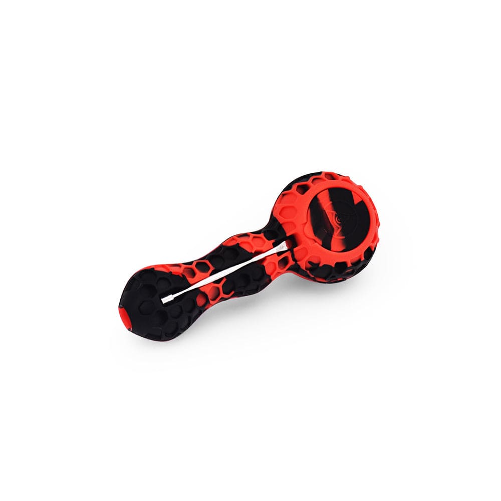 A close-up, angled view of the 4'' Silicone Spoon Pipe - Red & Black, showcasing its curved shape and two-tone color scheme.