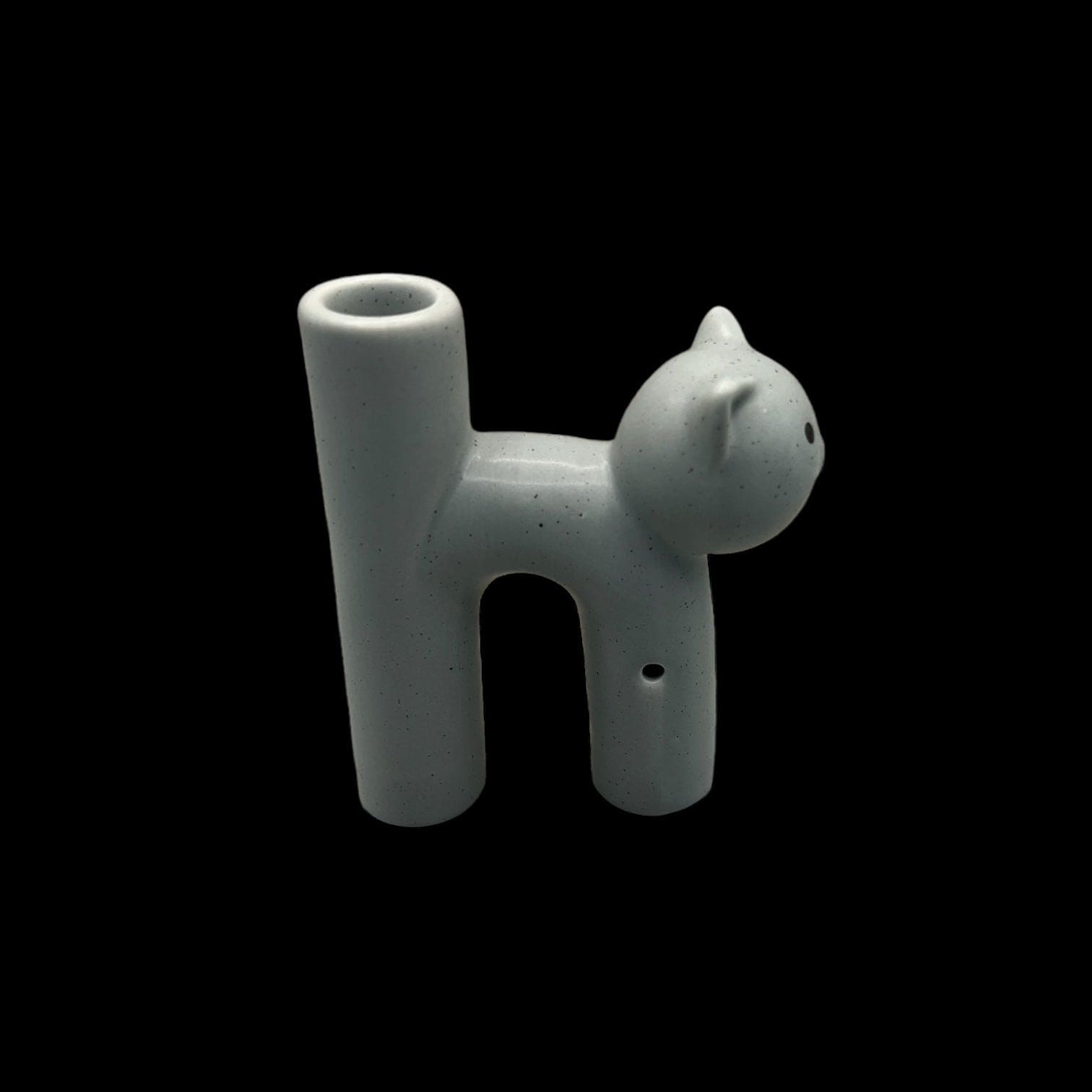 A studio shot of the Kitty Cat Pipe & Ashtray, displaying its ceramic feline form in a simple, clean composition.
