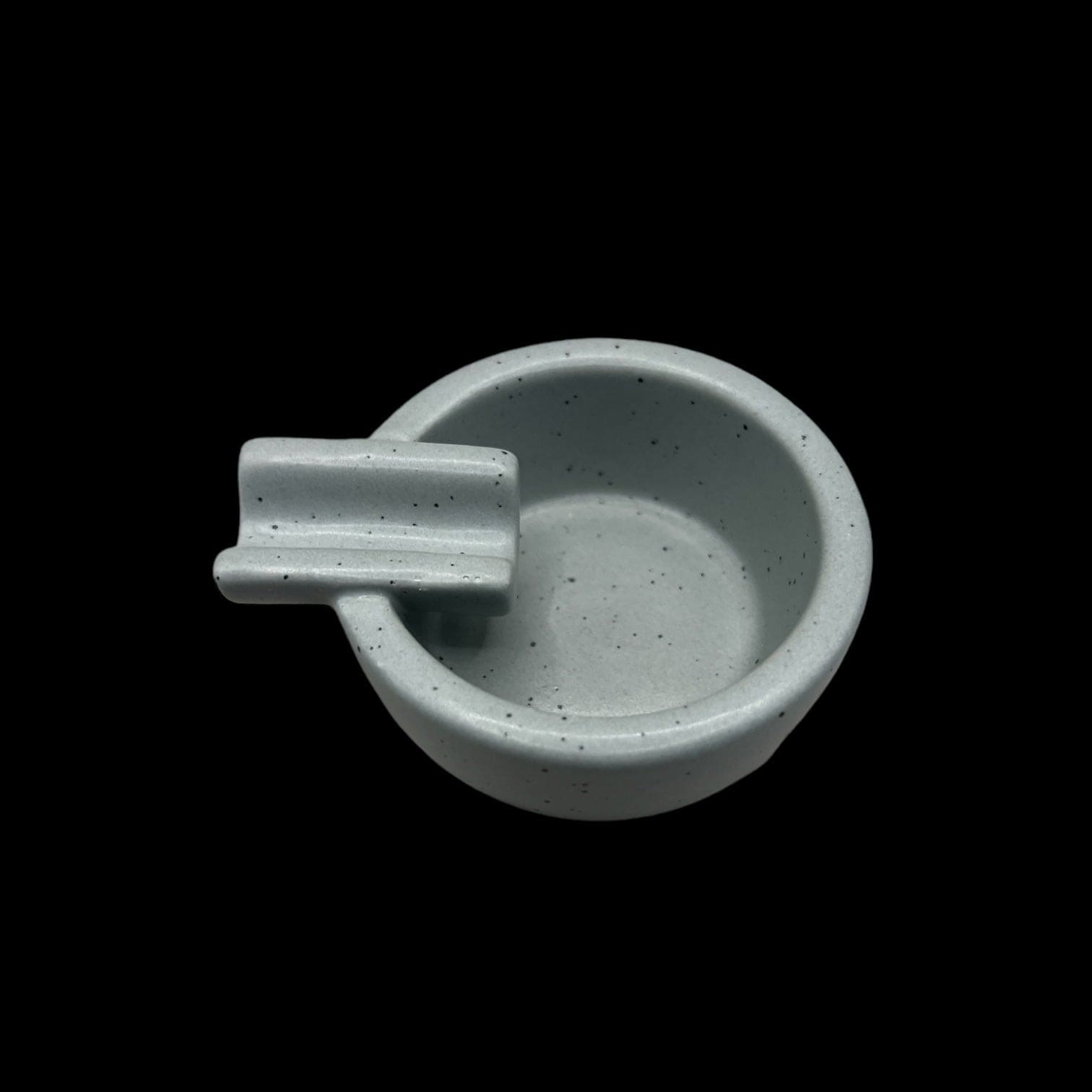 A top-down view of the Kitty Cat Pipe & Ashtray, showcasing its ceramic design and cat-shaped form.