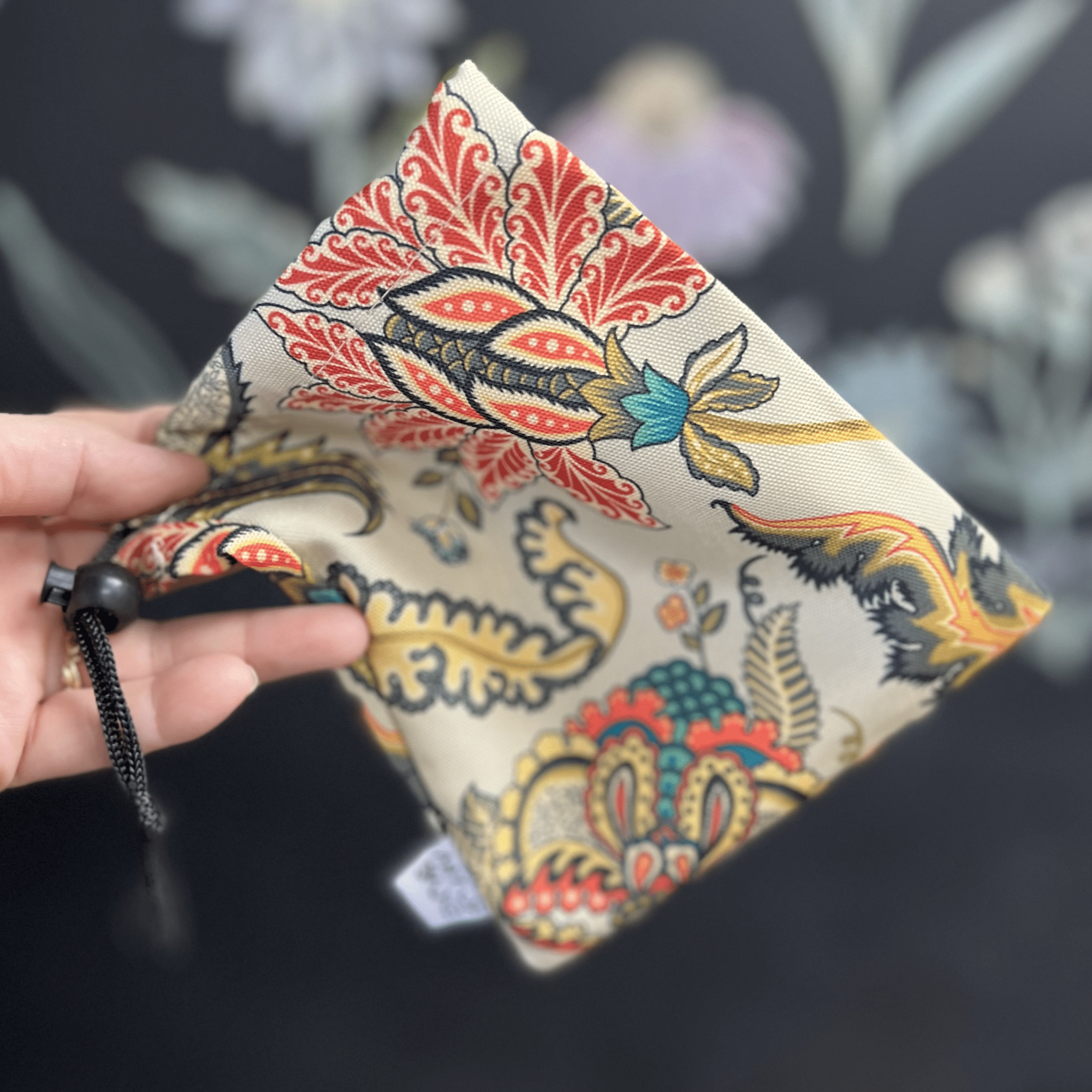 A close-up, angled view of the Baby Elephant Sherlock Pipe, showcasing its intricate patterned design against a dark background.