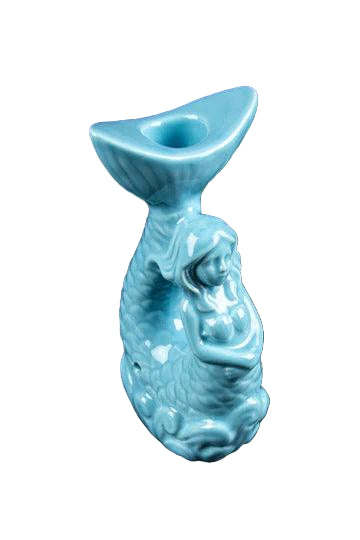 A close-up, side view of the Mermaid Pipe, a sculpted ceramic pipe resembling a mermaid, with a glossy finish.