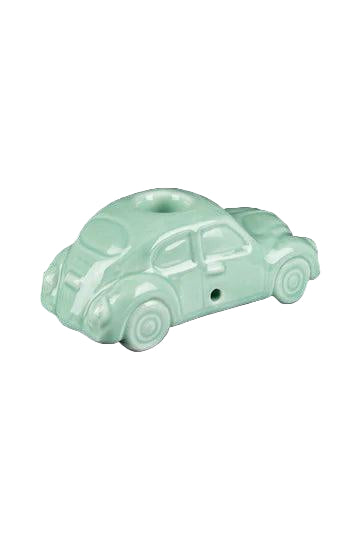 A detailed studio shot of the VW Beetle Pipe, presented as a sculpted ceramic object on a reflective black surface.