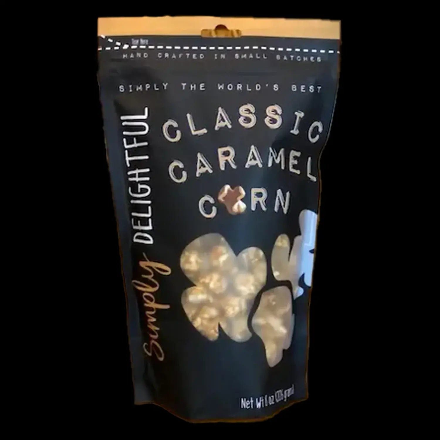 A close-up, front view of Simply Delightful Classic Caramel Popcorn in a clear plastic bag.