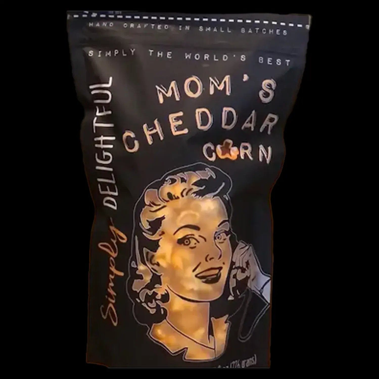 A close-up of Simply Delightful Mom's Cheddar Popcorn packaging with retro script and a golden yellow color scheme.