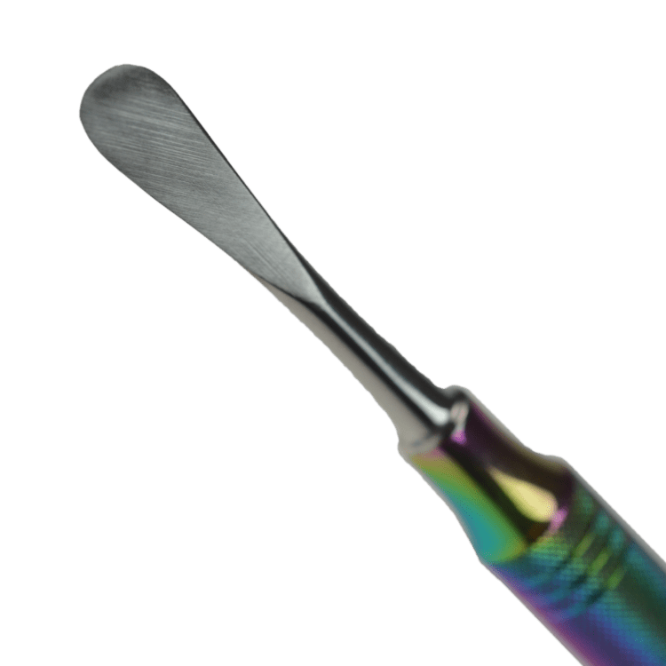 Close-up view of the Anodized Honeybun Dabber, featuring a polished, curved tip against a dark backdrop.