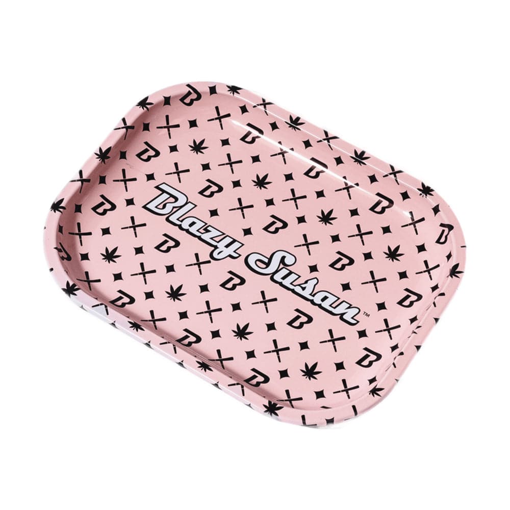 Angled top view of a pink Blazy Susan Metal Rolling Tray patterned with repeating black "B" logos, crosses and small leaf icons.