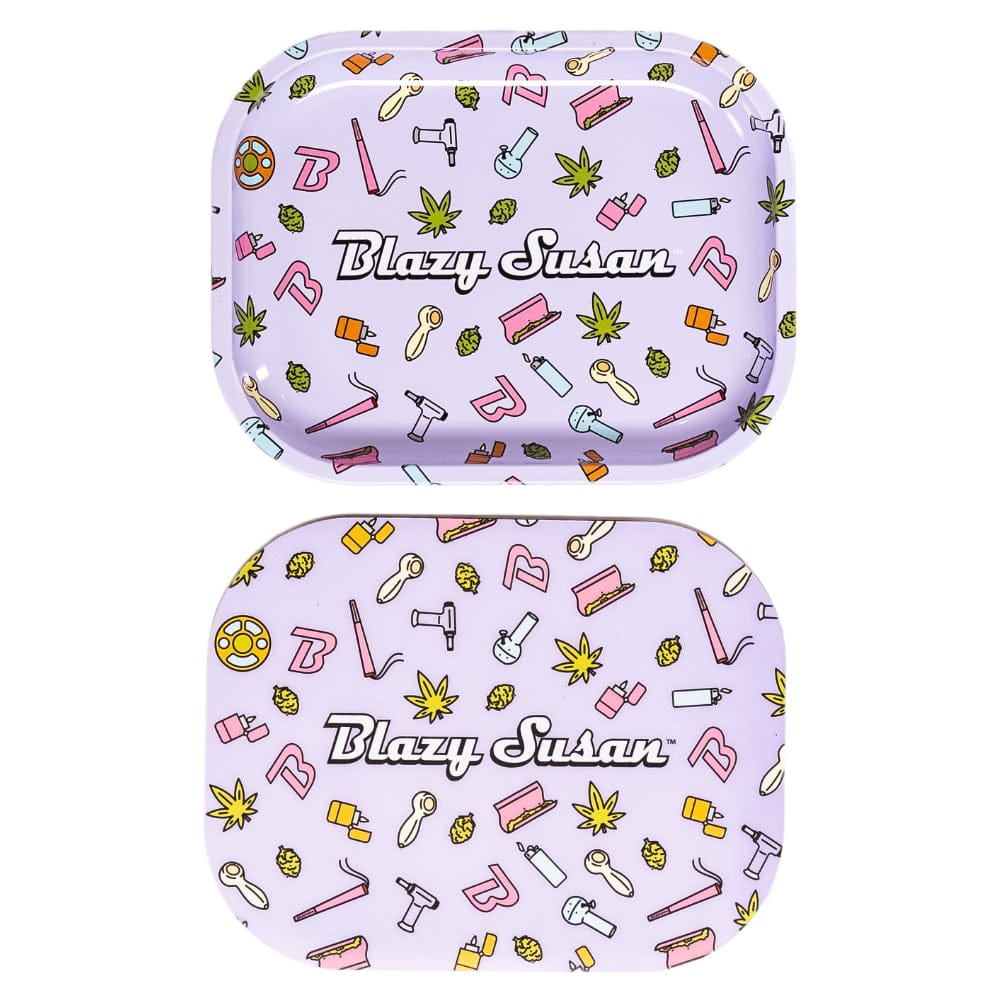 Top-down view of two matching lilac Blazy Susan Metal Rolling Tray pieces with repeating tiny smoking-themed icons and the "Blazy Susan" logo centered on each.