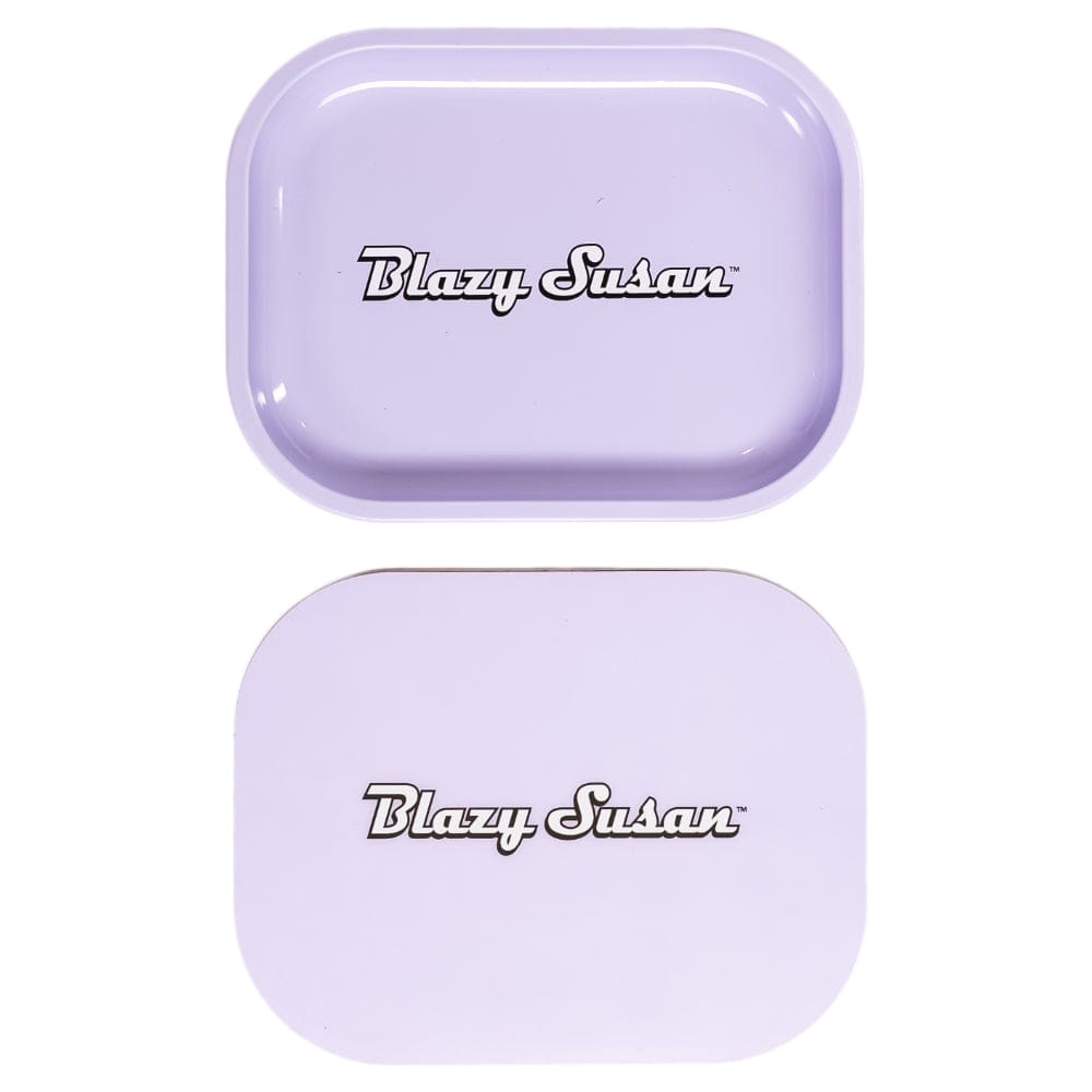 Top-down view of two small purple Blazy Susan Metal Rolling Tray pieces, one with a shallow lid and the other flat, both centered on white.