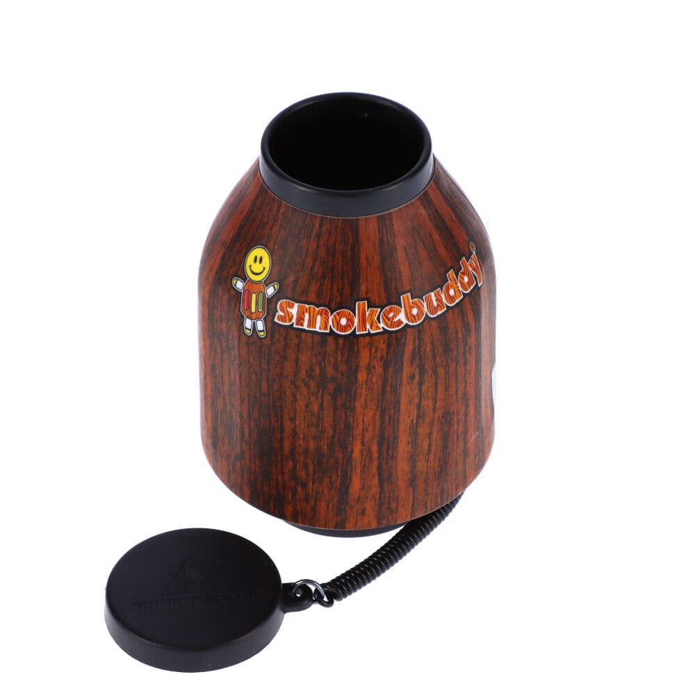 A three-quarter view of the Smoke Buddy Personal Air Filter, showing its cylindrical shape and dark gray color against a plain white background.