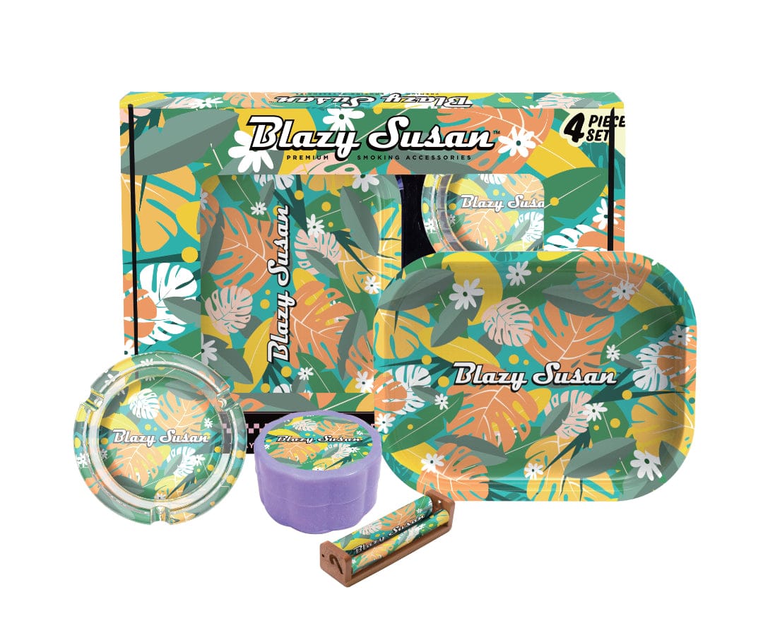 Angled front view of the Blazy Smoker's Kit showing a floral-patterned rolling tray, ashtray, purple grinder, rolling papers and box in a coordinated tropical design.