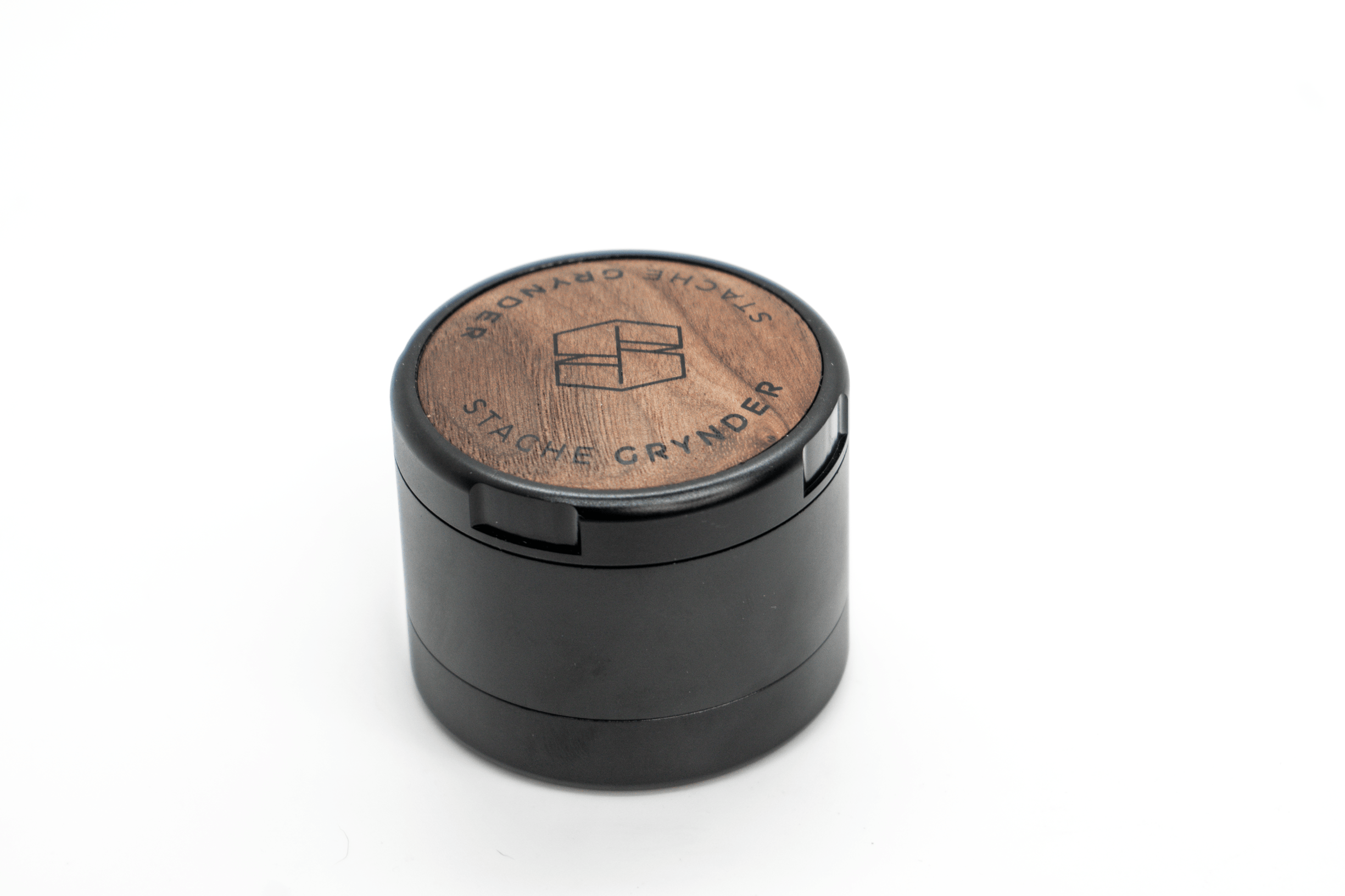 Close-up of the Grynder (N.Y.A.G) 3-Piece, a dark-colored cylindrical grinder shown from a slightly above angle.