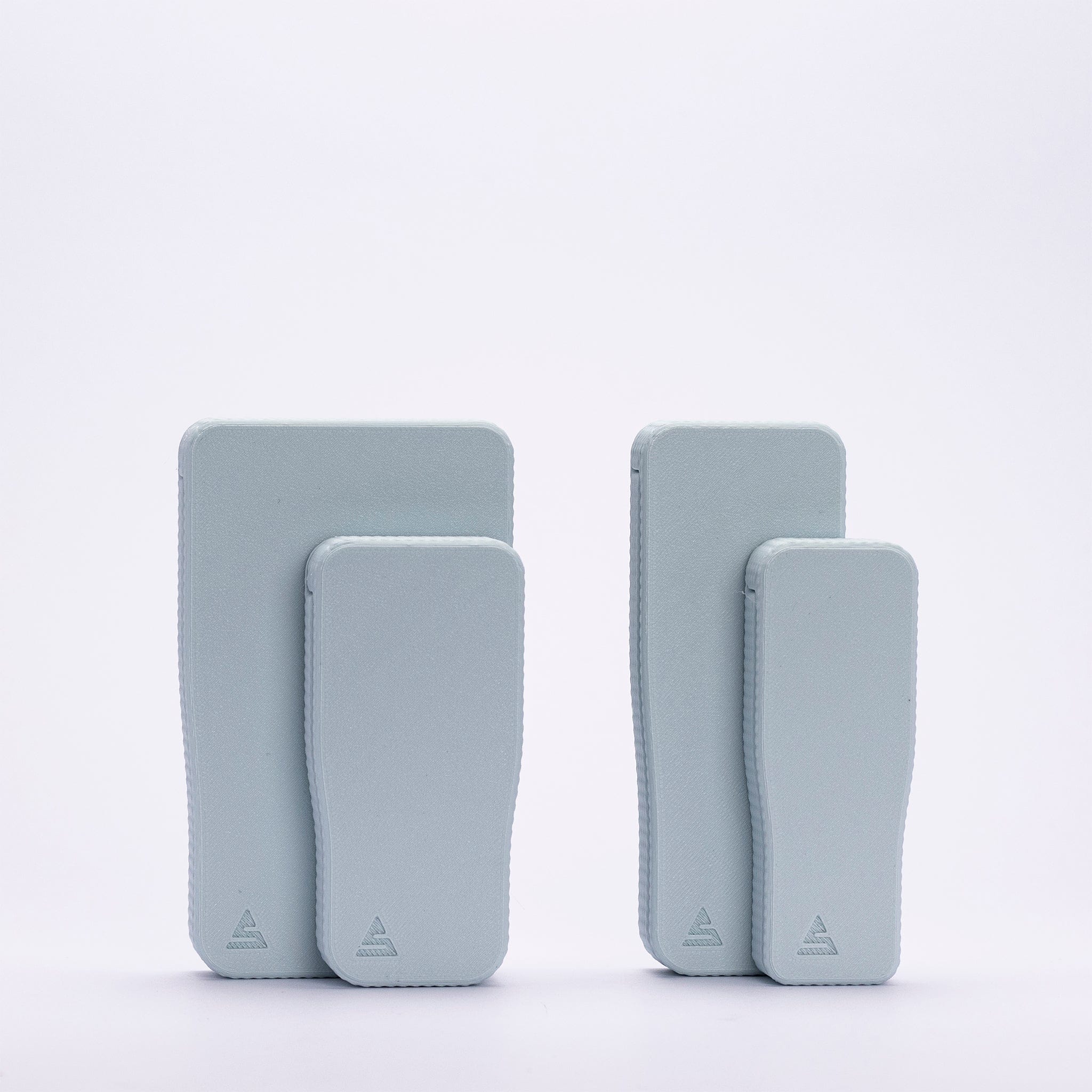 Close-up front view of two pastel blue STASURE Joint Case Pastel Polar Blue cases standing upright on a white background.