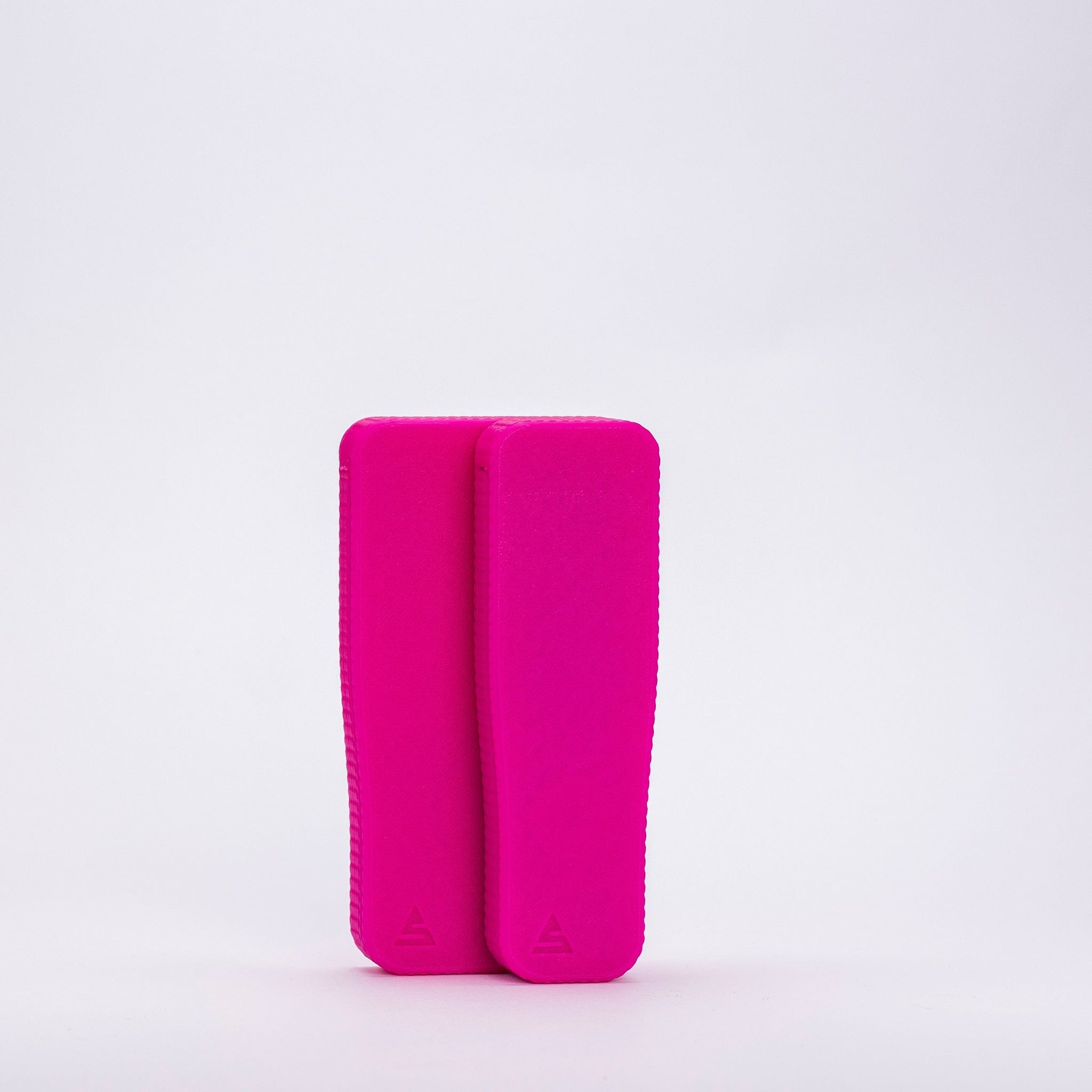 Close-up front view of two neon pink STASURE Slim Blunt Case Neon Pink sleeves standing upright on a white background.