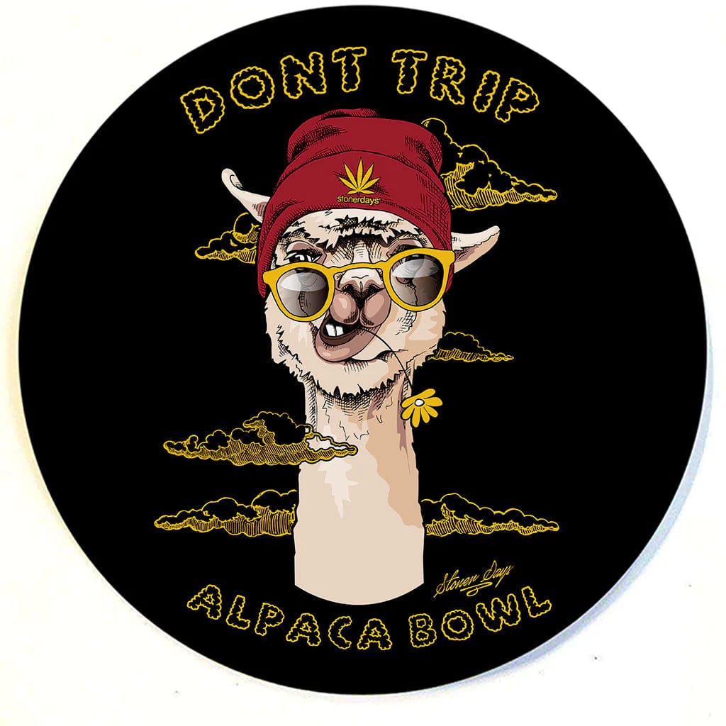 A vibrant, top-down view of the Stonerdays Round Dab Mats featuring a cartoon alpaca in sunglasses against a black background.