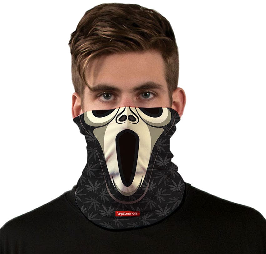 A close-up, front view of the Wazzzup Halloweed Gaiter, featuring a spooky, grinning skull design on a black fabric.