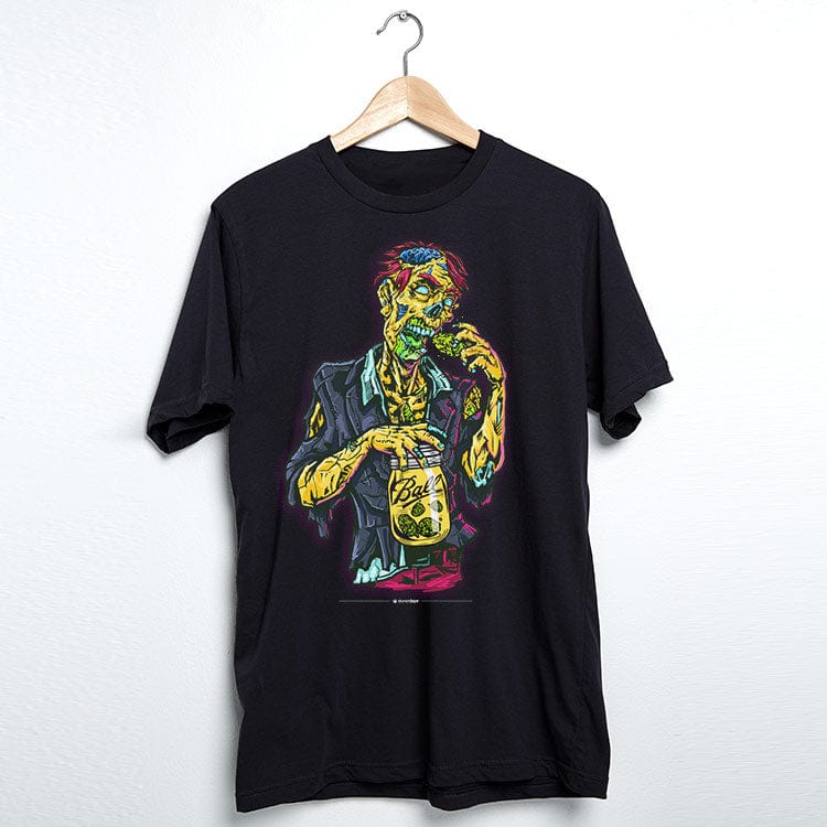 Front-facing black Zooted Zombie Tee on a wooden hanger, showing a colorful zombie holding a jar against a white wall.