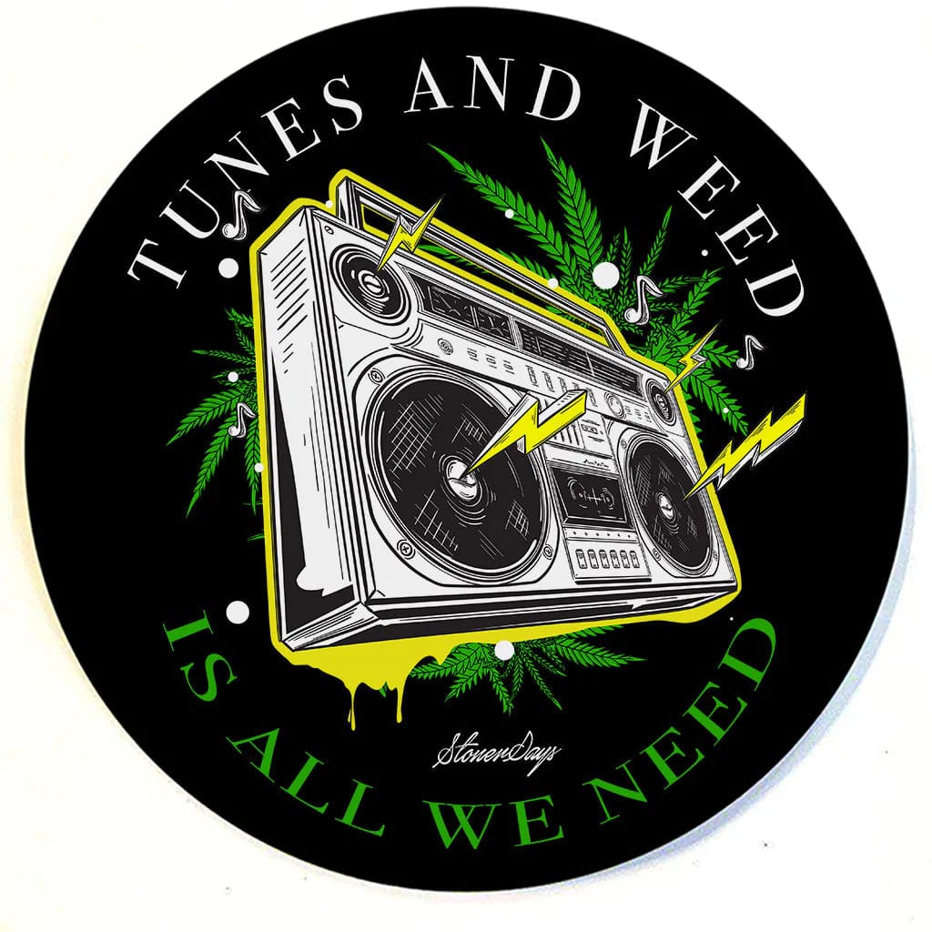 A top-down view of the round Stonerdays Dab Mats featuring text graphics and a vibrant design on a black background.