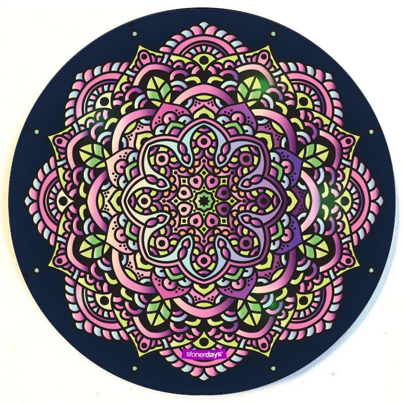 A top-down view of the Mandala Dab Mats featuring a colorful, intricate circular pattern on a black background.