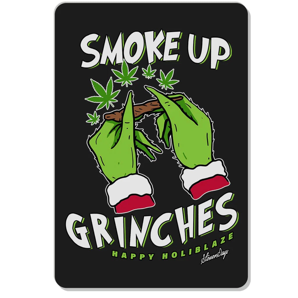 Holiday Themed Dab Mats display two hands appearing to “dab” with vibrant green cannabis leaves against a dark background.