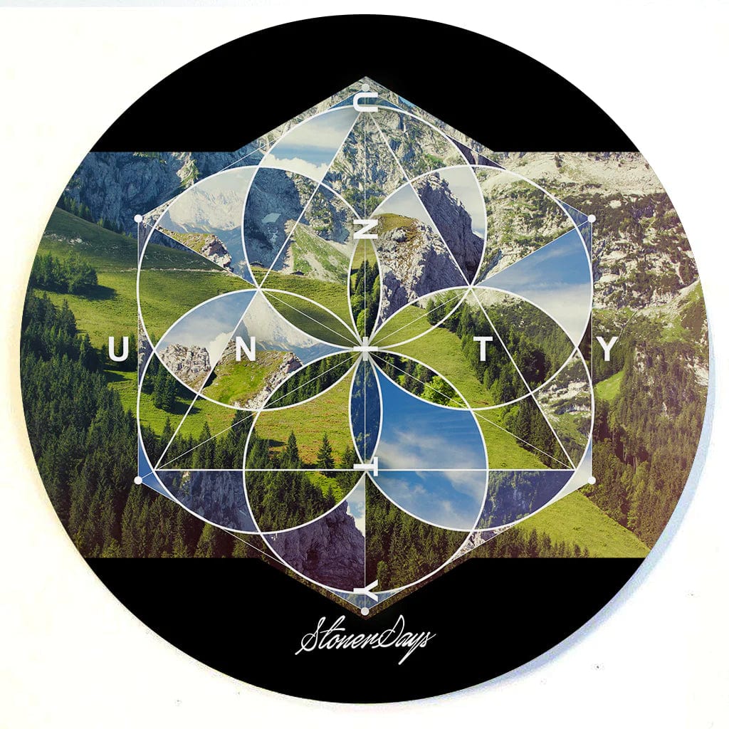 A top-down view of the Stonerdays Round Dab Mats featuring a geometric pattern over a vibrant nature scene.