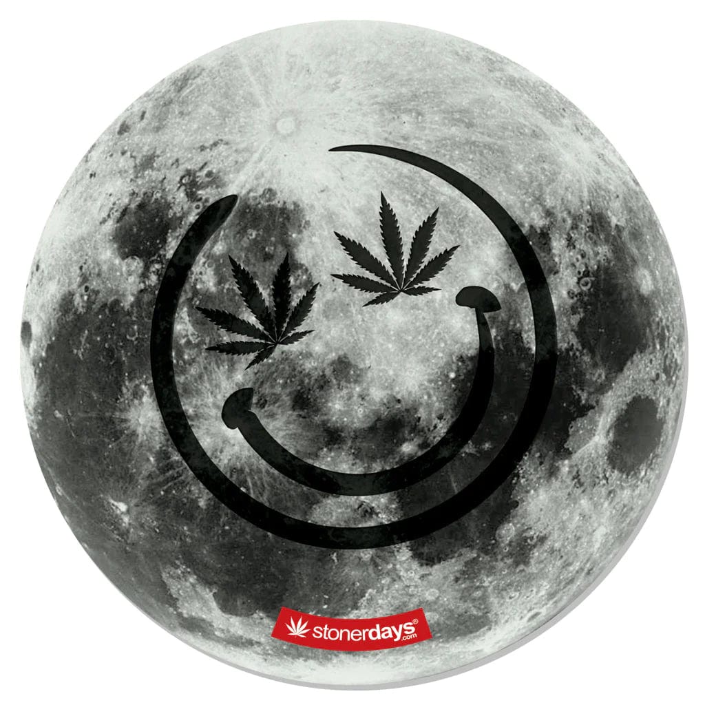 A top-down view of the round Stonerdays Dab Mats featuring a cosmic, moon-like design.