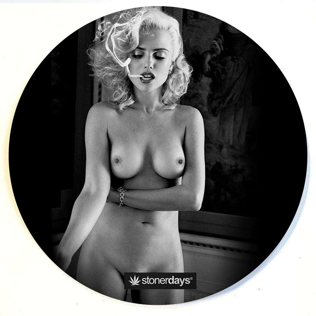 A top-down view of the Stonerdays Round Dab Mats featuring a woman with blonde hair in a black bikini.