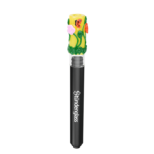Centered vertical studio shot of the Hose Tip Garden Variety showing a black Stündenglass shaft topped by a bright yellow, flower-decorated glass tip.