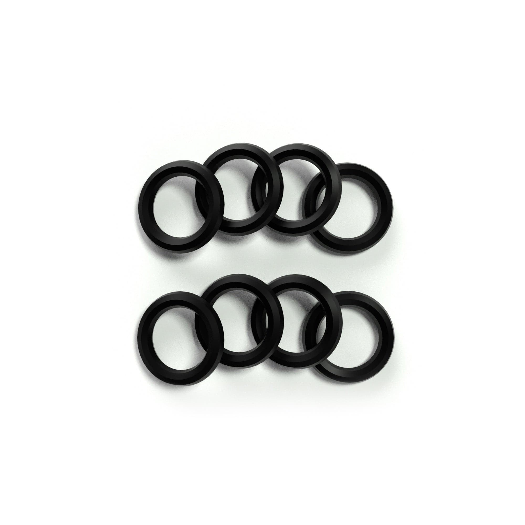 Close-up overhead view of stacked black rings from the Cleaning Kit arranged in two overlapping rows on a white background.