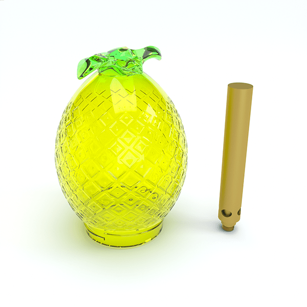 Front-lit studio shot of the Kompact Pineapple Globe (Single), a faceted yellow-green glass pineapple object shown alongside its slim gold accessory.