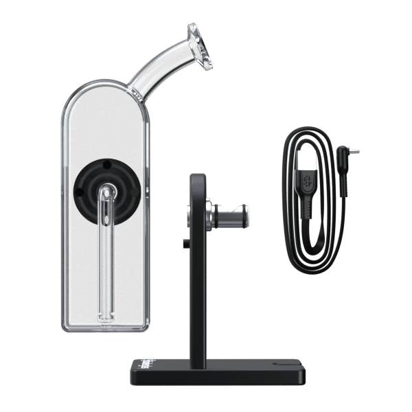 Centered front view of the Modül Dok showing its glass mouthpiece and chamber, upright black stand, and coiled USB cable on a white background