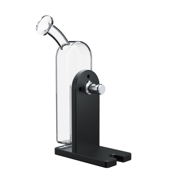 Three-quarter view of the Modül Dok showing its black metal base and upright support with a chrome pivot knob and attached curved glass tube.