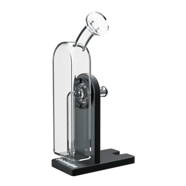 Angled front view of the black and clear Modül Dok standing on its rectangular base with a curved glass tube and visible internal chamber.