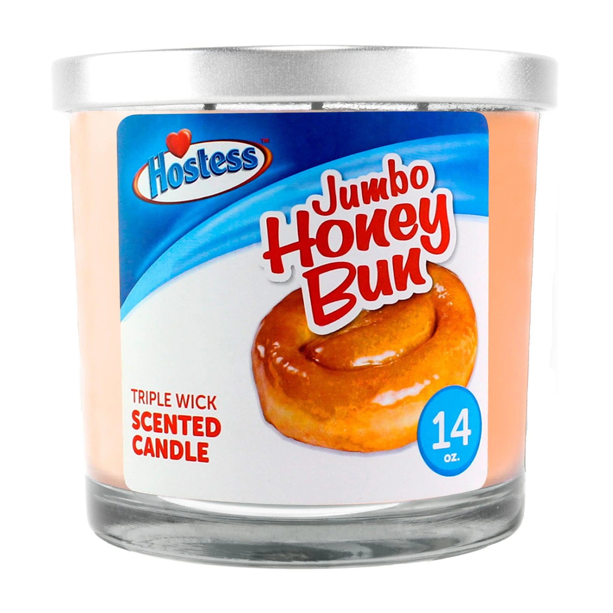 Close-up front view of the 14oz Candy Scented Candles showing a silver lid, a blue Hostess label and a glazed donut image on the peach-colored wax.