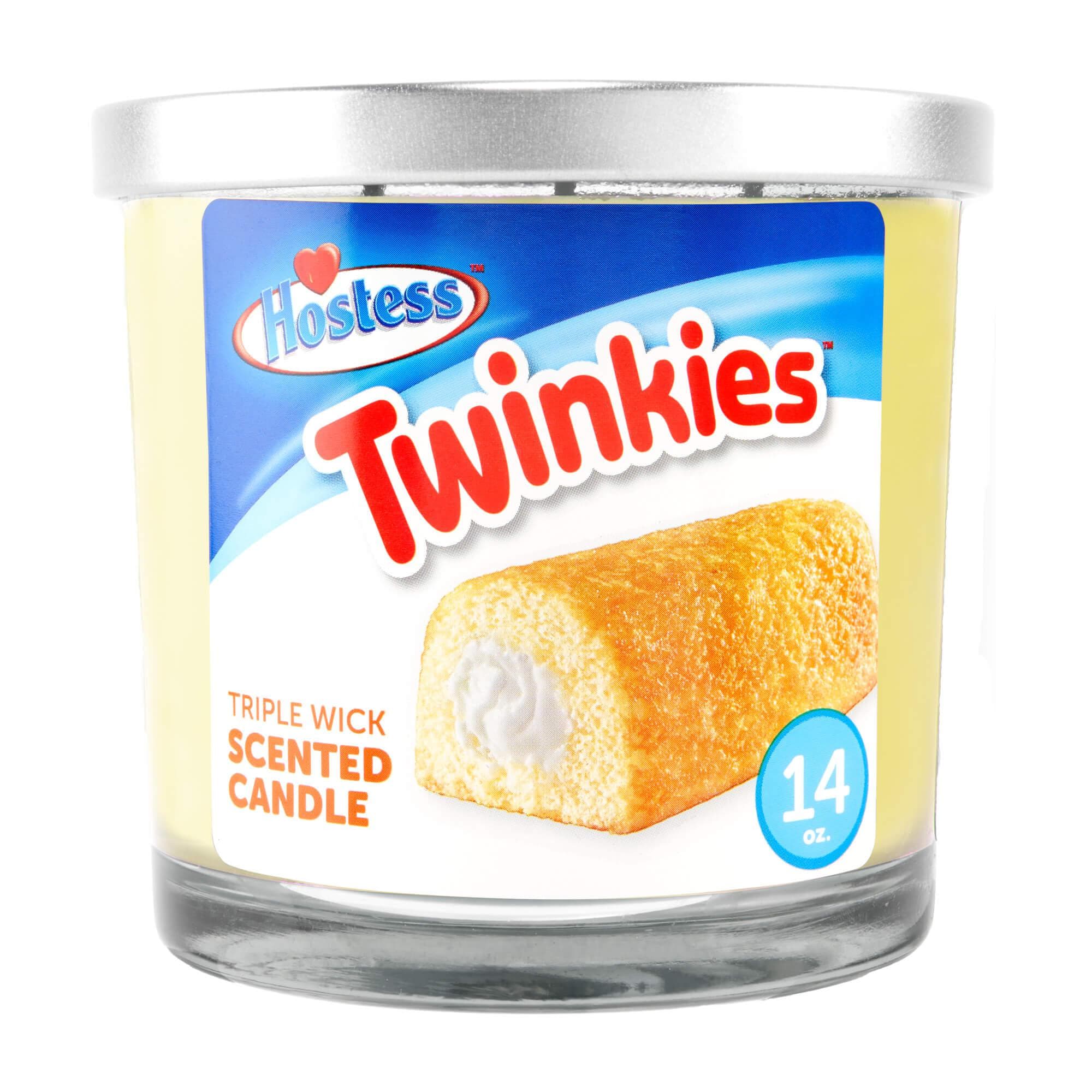 Close-up front view of a Hostess 14oz Candy Scented Candles jar showing the silver lid, Twinkies label art and glass base.